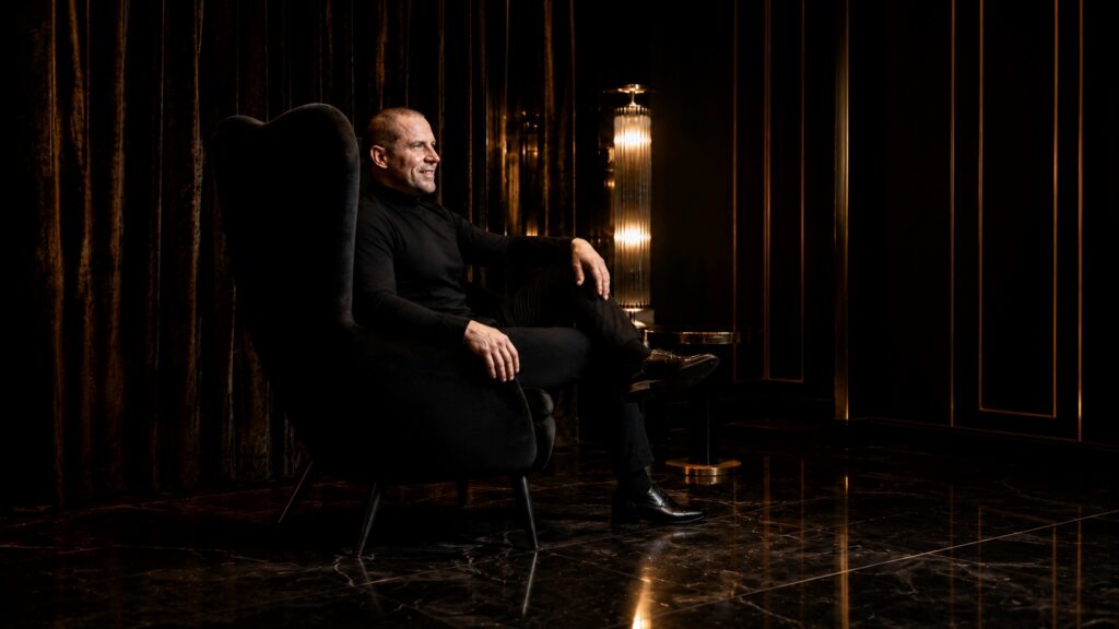 Barry Roberts Amber-lit side profile in luxury noir