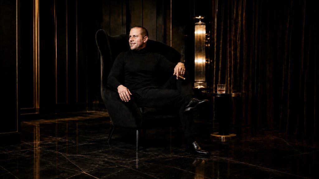 Barry Roberts Whisky, cigar, and black chair